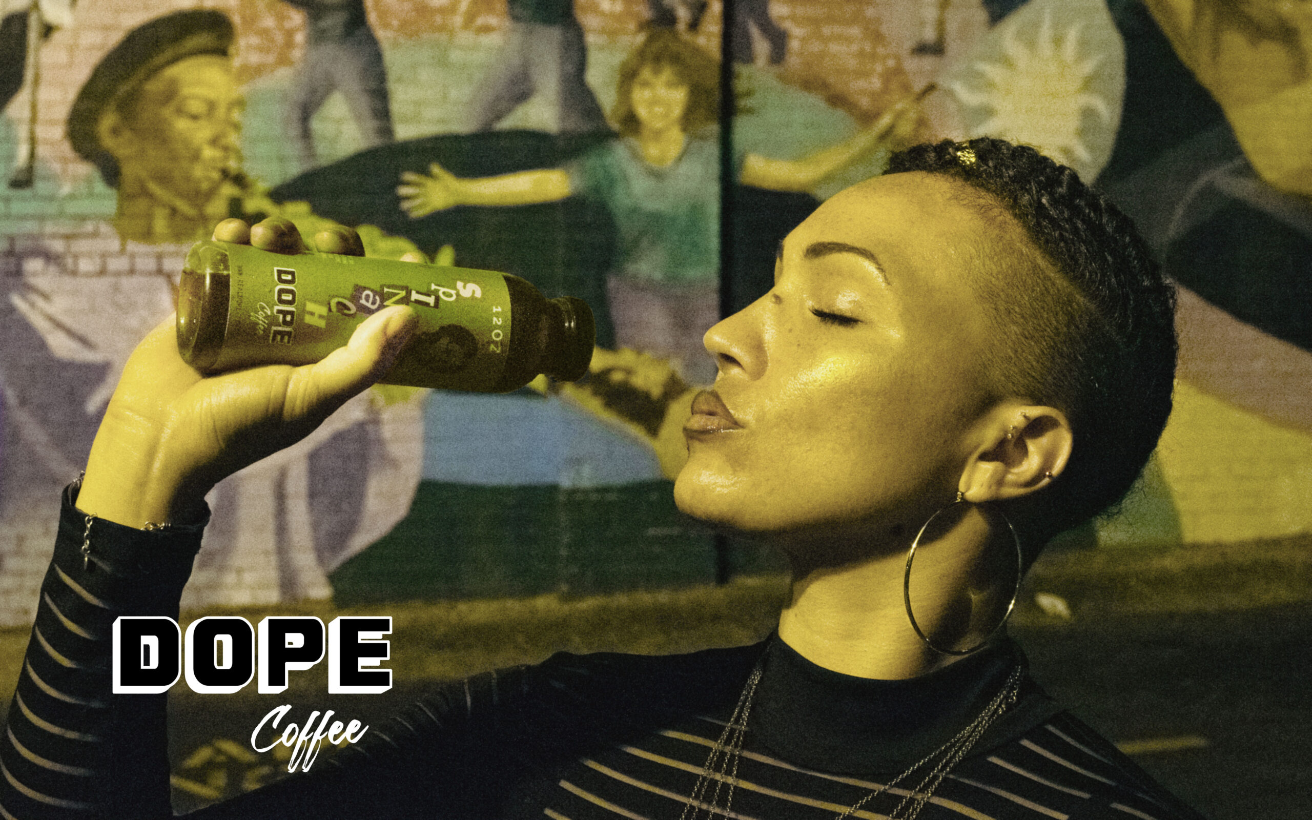 A Dope Coffee ready-to-drink, enjoyed at a mural